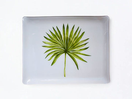 A rectangular white acrylic serving tray with rounded corners, featuring a printed green palm leaf design in the center, set against a plain white background.